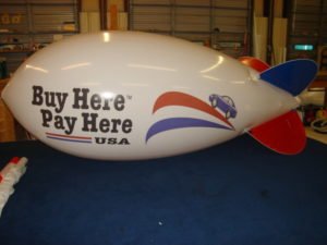 custom advertising blimps for car dealerships.