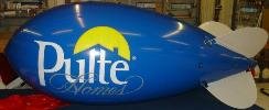 helium advertising blimp with logo